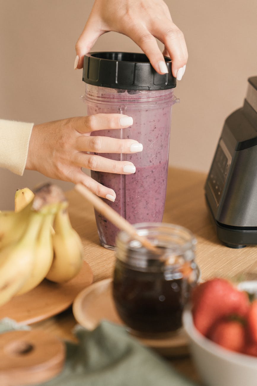 hands of a person holding a plastic tumbler